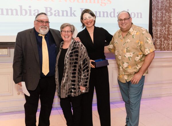 EPIC-honor EPIC Honor recipients. Patricia and Katie stand with two men on a stage