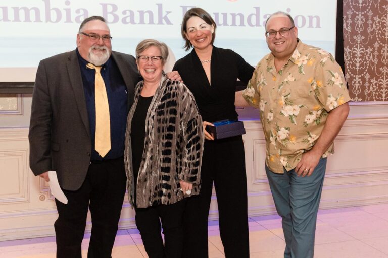 EPIC-honor EPIC Honor recipients. Patricia and Katie stand with two men on a stage