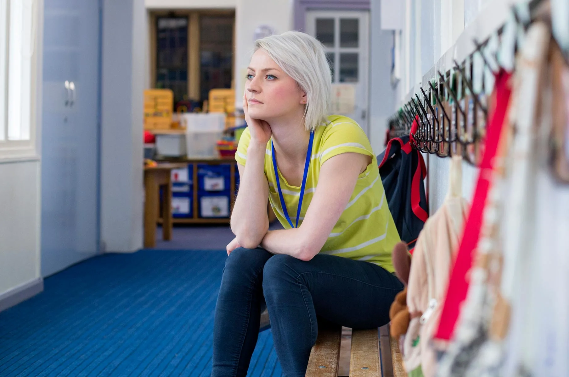 a woman sitting in a school