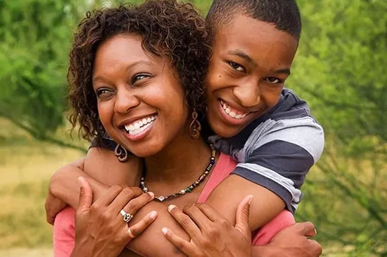 Showcase the Good featured image, Showcase the good. Teenage son is hugging mother