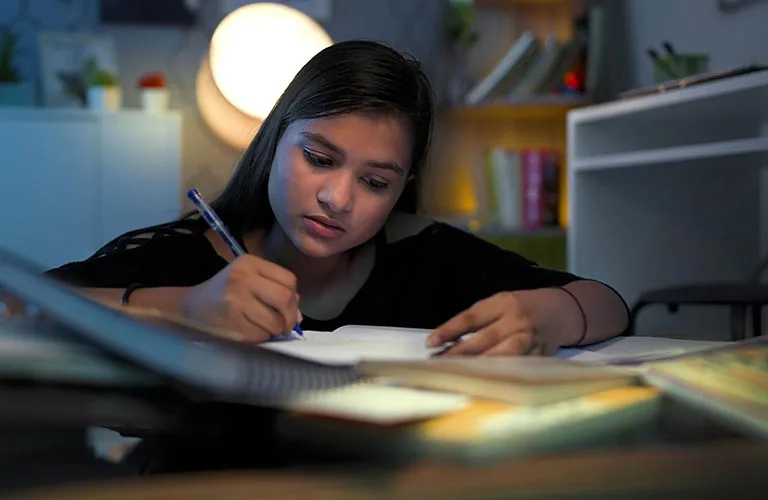 Gratitude Letter Writing featured image - girl writing a letter