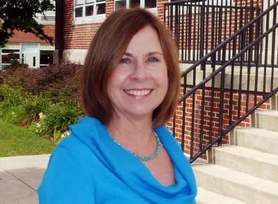 400x293_YALE_PartII (1) Peggy Chapman smiling for her headshot