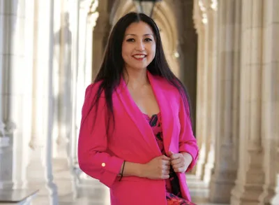 Marisa_2 Marisa is smiling wearing a pink suit jacket
