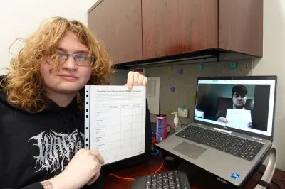 400x293_BalanceAutism An RSP and her client on the laptop screen hold up their copies of the PERMA+ snapshot.