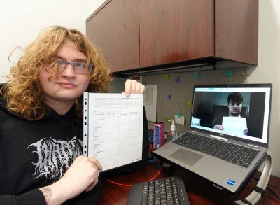 400x293_BalanceAutism An RSP and her client on the laptop screen hold up their copies of the PERMA+ snapshot.