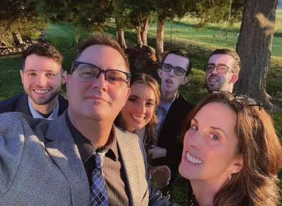 400x293_Theresa&Fam The Forthofer family, smiles for a selfie on a walk in a park. The photo is of Theresa, her husband, her daughter and her husband, and her two sons, Ryan and Justin.