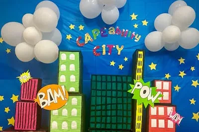 Easterseals Southern California's decorated wall "cape-ability city" with buildings and balloons for clouds