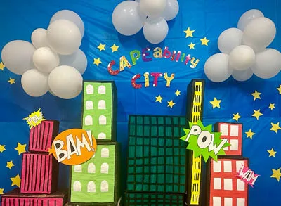 400x293_Jessica_ESSC3 Easterseals Southern California's decorated wall "cape-ability city" with buildings and balloons for clouds
