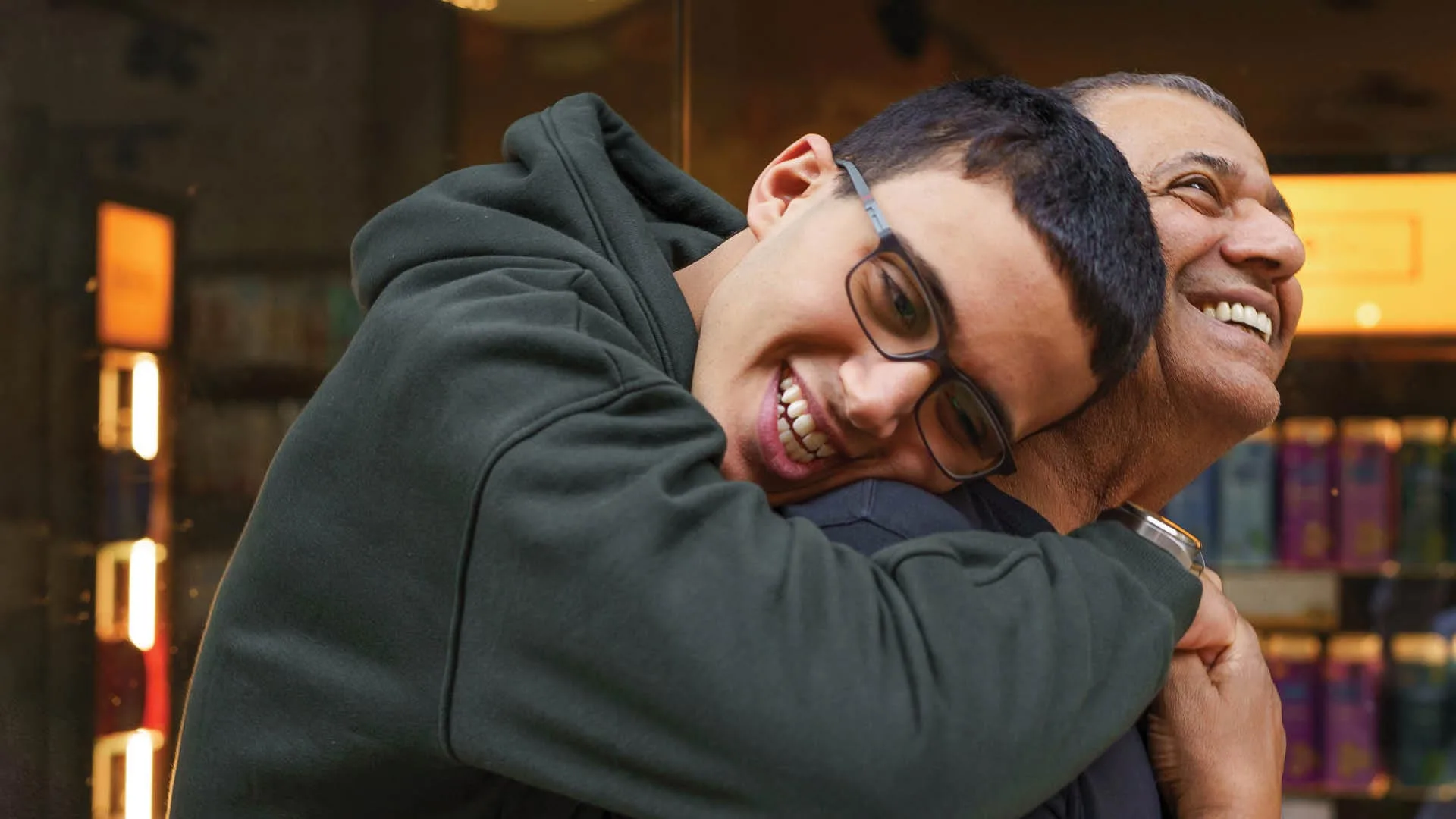 Son hugging father