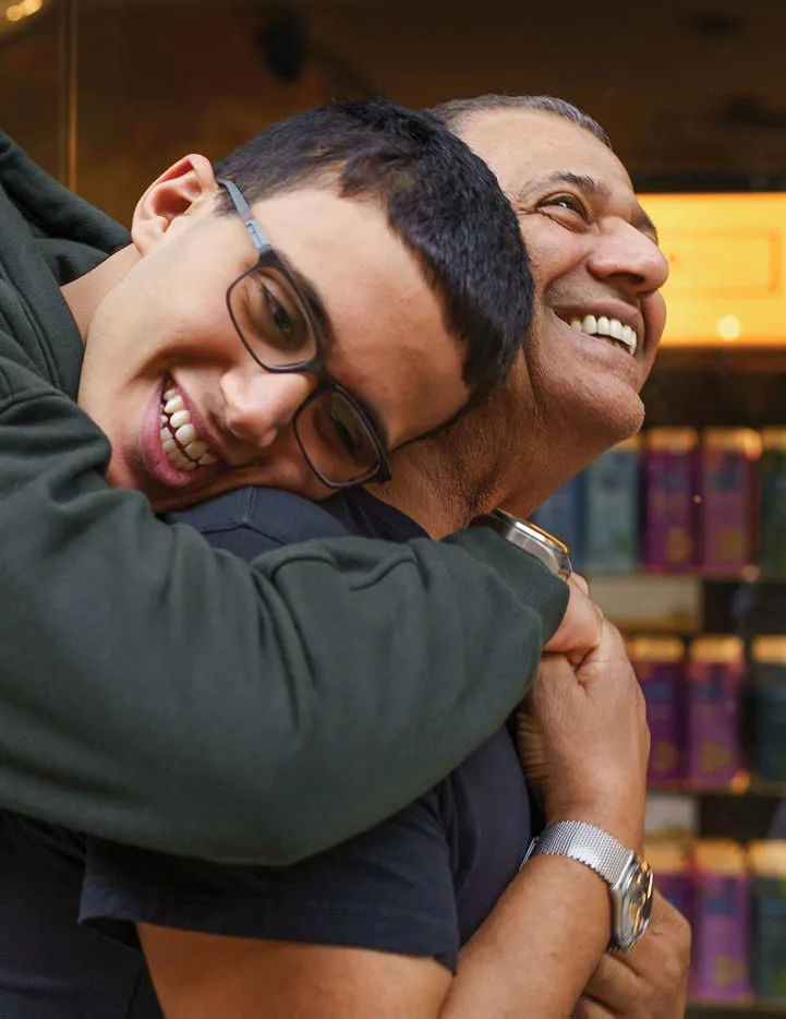 Son hugging his father