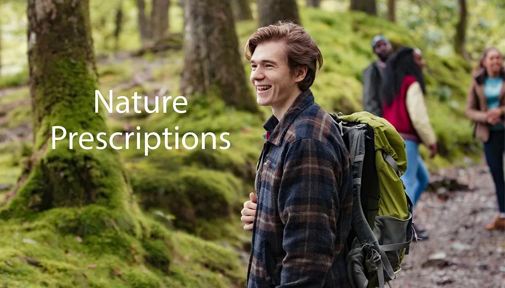 Smiling young man hiking in the woods with friends. Text says 