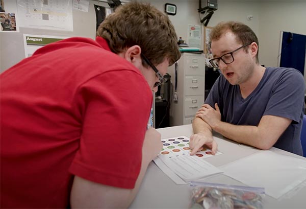 Two men reviewing survey results