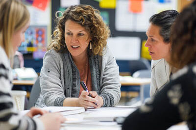 400x293_Sept2025BlogPics4 Teachers meet around a table