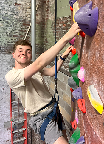 Sebastian on a climbing wall