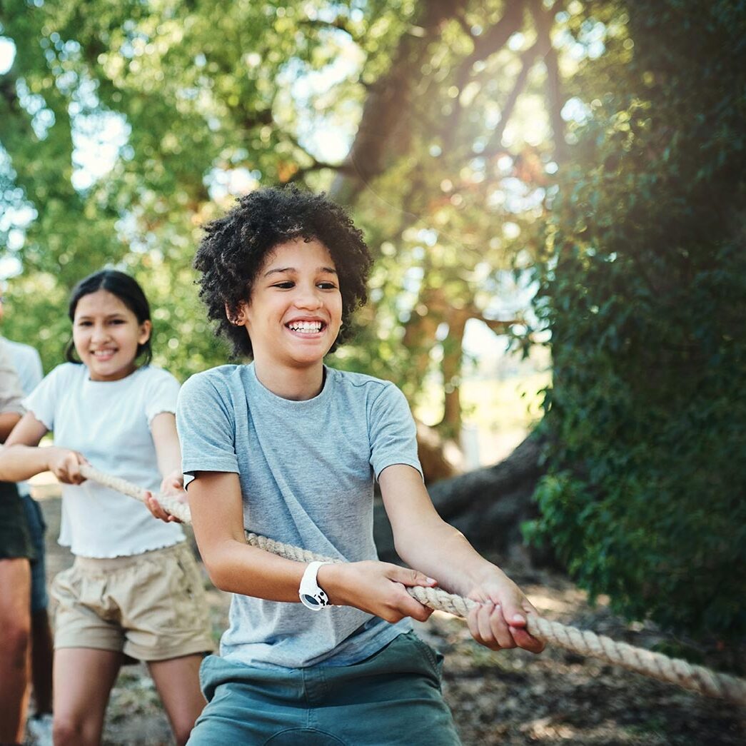 young people playing tug of war